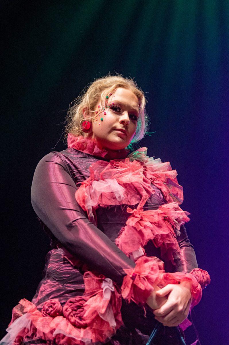 Carly Jones, a third-year studying communications, models a piece designed by Madeleine Tharrington during the Art2Wear dress rehearsal at Stewart Theatre on Tuesday, April 25, 2023. Tharrington's collection was titled "Bloom."