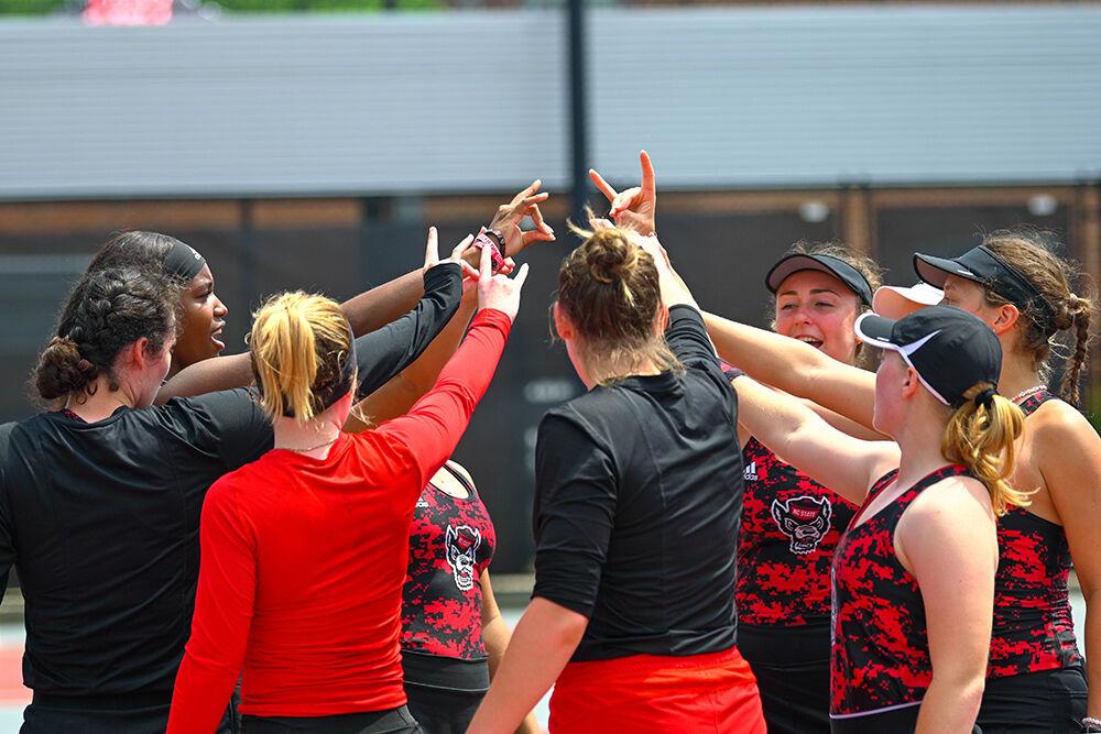 The NC State women's tennis team huddles together before the matches against Virginia Tech at&#160;Dail Outdoor Tennis Stadium on Sunday, April 16, 2023. NC State beat Virginia Tech 7-0.