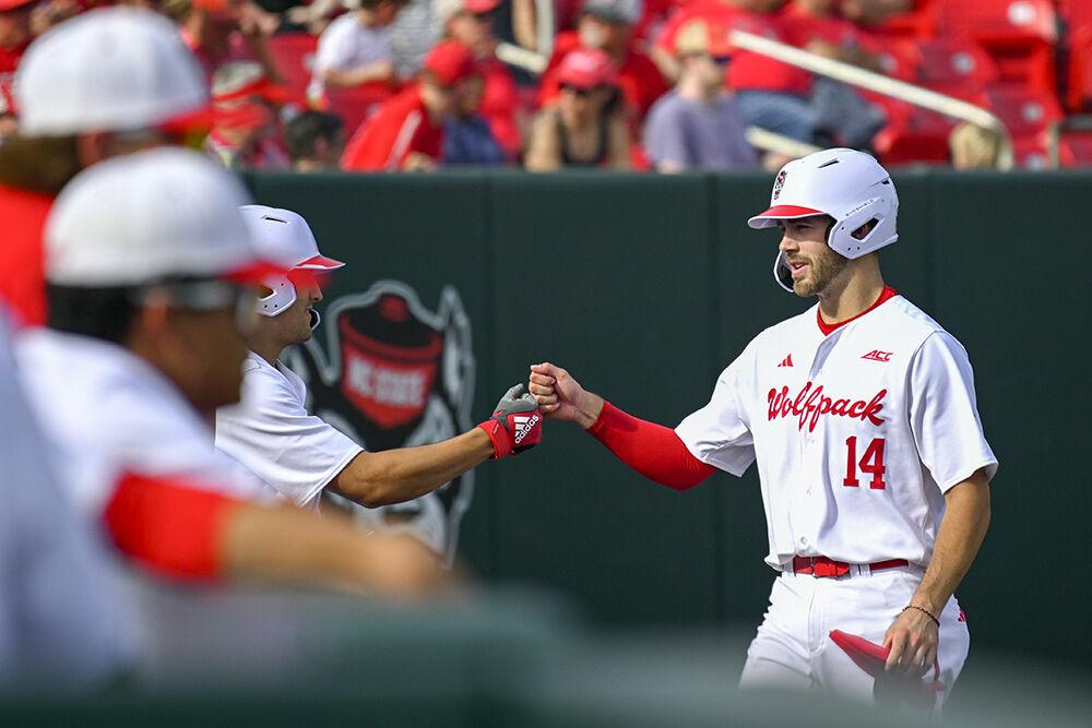 Sophomore infielder Jacob Cozart gives a fist bump to his teammates after hitting a home run during the game against The Citadel at Doak Field at Dail Park on Saturday, April 29, 2023. Cozart scored one run. NC State beat The Citadel 12-3.