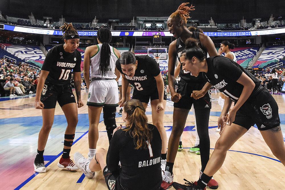 The NC State women's basketball team yells in celebration as graduate center River Baldwin gets fouled while shooting a basket during the quarterfinals game of the ACC tournament against Notre Dame in Greensboro Coliseum on Friday, March 3, 2023. River made four rebounds.&#160;NC State lost to Notre Dame 66-60.