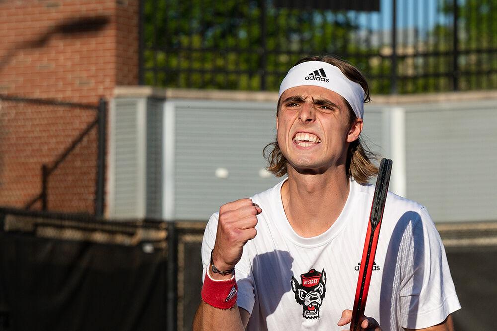 Senior Robin Catry celebrates after scoring a point during the match against Wake Forest at Dail Outdoor Tennis Stadium on Wednesday, April 12, 2023. Catry won both his singles and doubles matches. NC State beat Wake Forest 4-2.