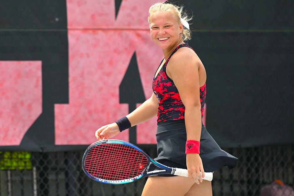 Freshman Diana Shnaider smiles after gaining a point during the match against Virginia Tech at&#160;Dail Outdoor Tennis Stadium on Sunday, April 16, 2023. Shnaider won her doubles and singles match. NC State beat Virginia Tech 7-0.