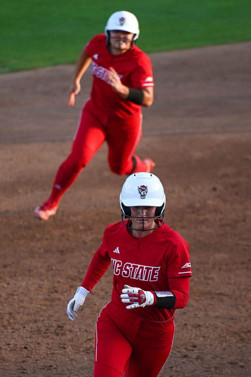 (From top) Freshman catcher Amanda Hasler and graduate outfielder Katlyn Pavlick run during the game against UNC-Chapel Hill at Dail Softball Stadium on Friday, April 21, 2023. NC State lost to the Tar Heels 5-4.