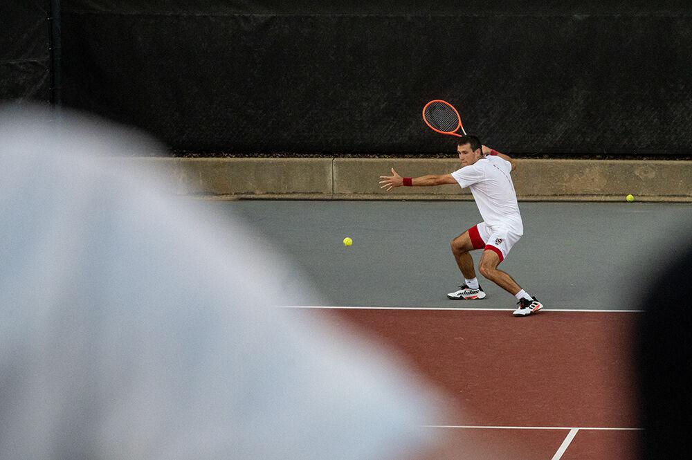 Junior Luca Staeheli prepares to hit the ball during the match against Wake Forest at Dail Outdoor Tennis Stadium on Wednesday, April 12, 2023. Staeheli won his doubles match and his singles match went unfinished. NC State beat Wake Forest 4-2.