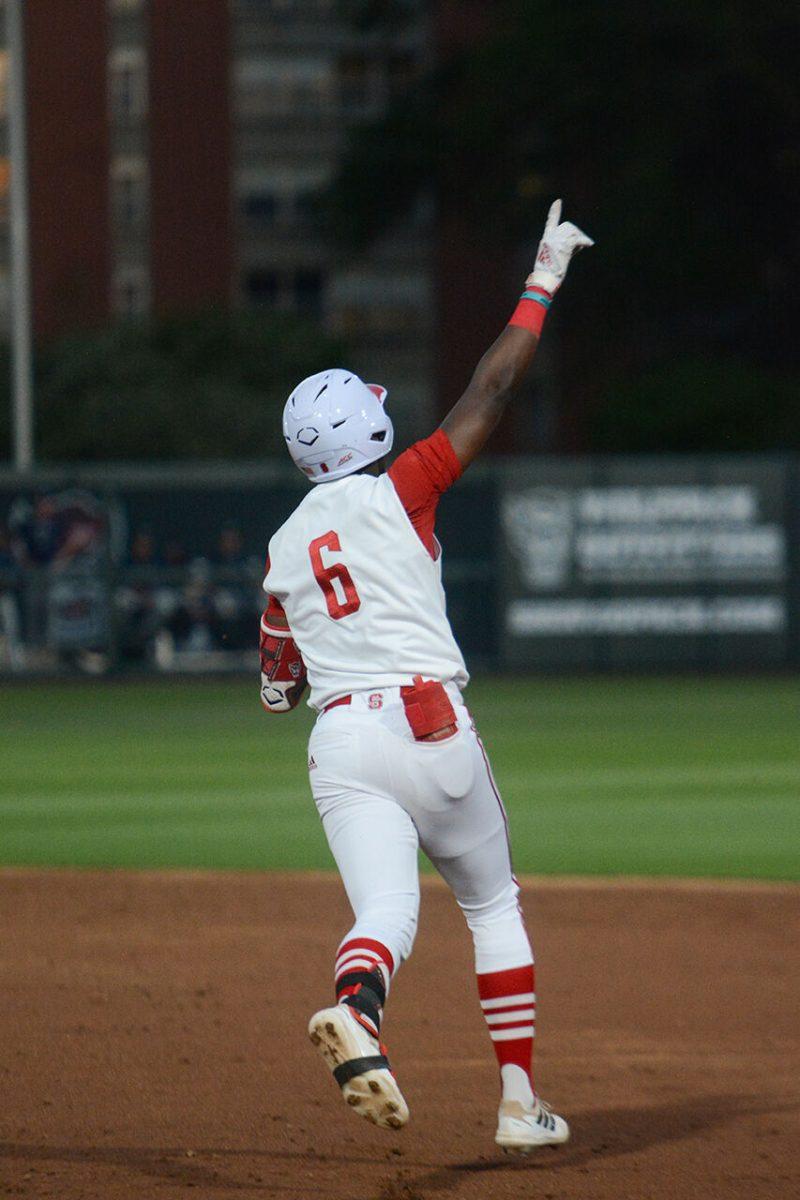 Junior infielder LuJames Groover hits a home run at the Wolfpack's home game against the Seahawks from UNC-Wilmington at Doak Field in Dail Park on Tuesday April 11, 2023. Groover had three hits, two runs and one RBI. The Wolfpack won 12-3.