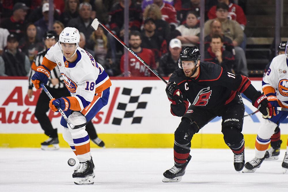 Carolina Hurricanes center Jordan Staal defends a New York Islanders opponent in PNC Arena on Sunday, April 2, 2023. The Hurricanes won 2-1.