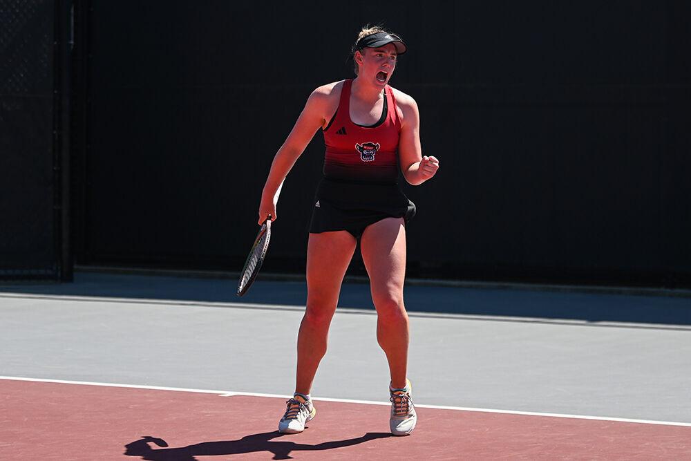 Junior Amelia Rajecki yells in celebration during the match against Texas at Dail Outdoor Tennis Stadium on Monday, April 10, 2023. NC State beat Texas 5-2.