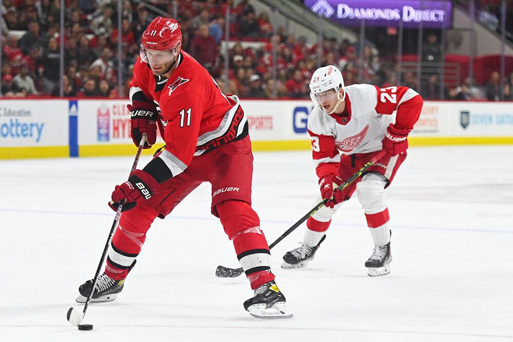 Carolina Hurricanes center Jordan Staal dribbles the puck up the ice during the game against the Detroit Red Wings in PNC Arena on Tuesday, April 11, 2023. The Hurricanes won 4-1.