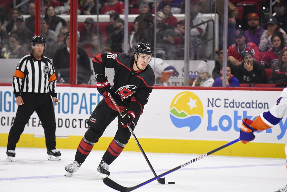 Carolina Hurricanes defenseman Brady Skjei dribbles the puck up the ice during the game against the New York Islanders in PNC Arena on Sunday, April 2, 2023. The Hurricanes won 2-1.