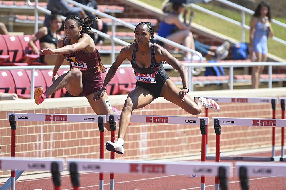 Graduate hurdler Timara Chapman scales the hurdle during the Raleigh Relays track meet at the Derr Track and Field Facility on Friday, March 24, 2023. Chapman finished the women's 100-meter hurdles with a time of 14.40.
