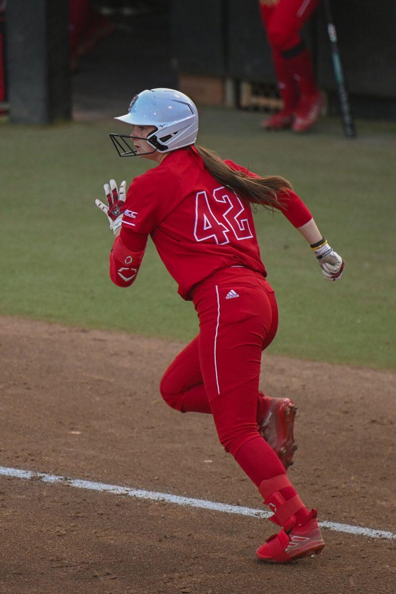Graduate outfielder Rebecca Murray runs to first base during the game against UNC-Chapel Hill at Dail Softball Stadium on Friday, April 21, 2023. NC State lost to the Tar Heels 5-4.
