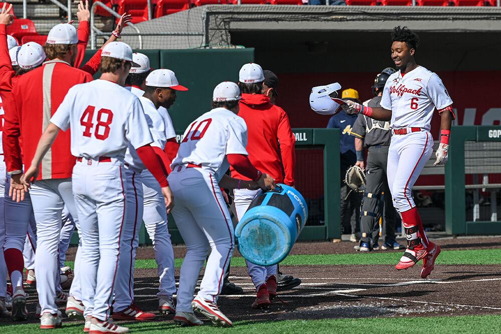 Junior infielder LuJames Groover celebrates with the team at home plate after hitting a home run during the game against&#160;North Carolina A&amp;T at Doak Field at Dail Park on Tuesday, May 2, 2023. Groover scored one run and had two RBIs. NC State beat&#160;North Carolina A&amp;T 6-5.