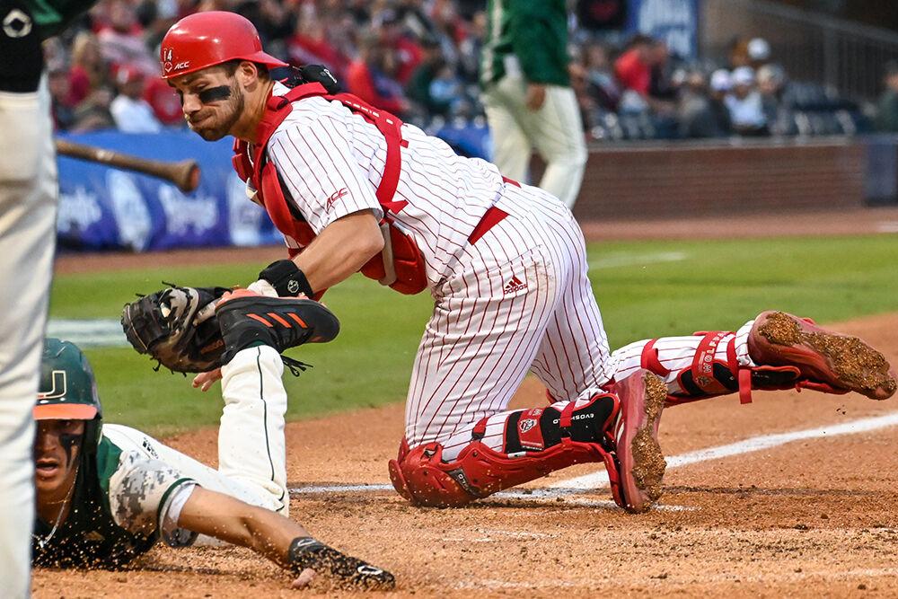 Sophomore catcher Jacob Cozart attempts to tag a runner out during the ACC Tournament game against Miami at Durham Bulls Athletic Park on Thursday, May 25, 2023. Cozart completed 13 put outs for the Wolfpack. NC State lost to Miami 4-2.