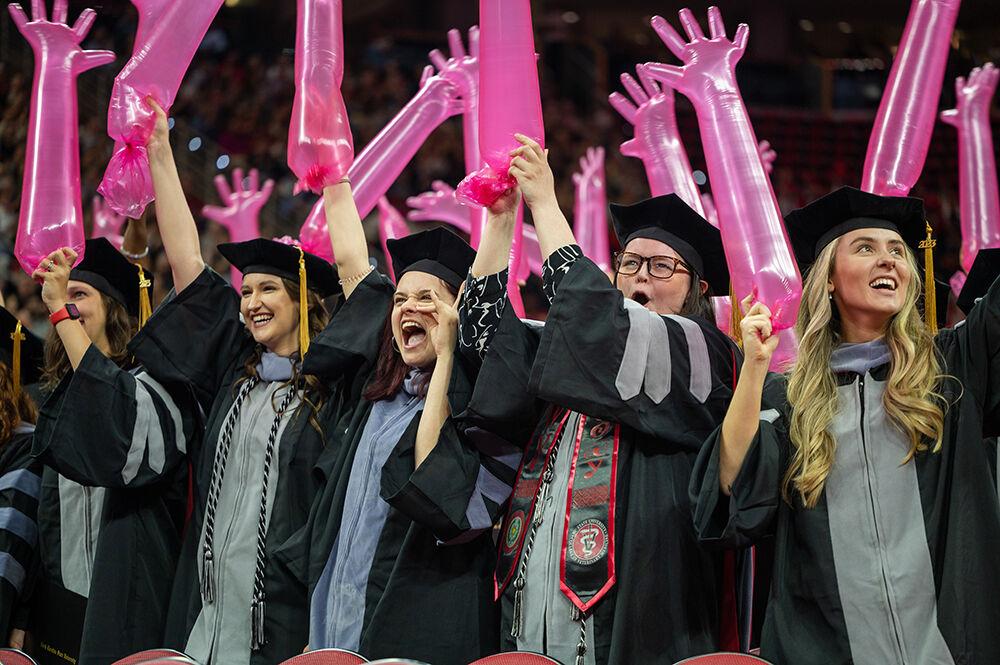 Abby Cox Laws, a doctoral student in veterinary medicine, and friends celebrate during the Spring Commencement Ceremony in PNC Arena on Saturday, May 6, 2023. Cox Laws worked under the guidance of Dr. Marine Traverson, DVM, MS, DACVS, ACVS Fellow of Surgical Oncology, at NC State College of Veterinary Medicine.