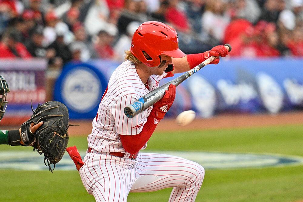 Freshman infielder Matt Heavner bunts the ball during the ACC Tournament game against Miami at Durham Bulls Athletic Park on Thursday, May 25, 2023. NC State lost to Miami 4-2.
