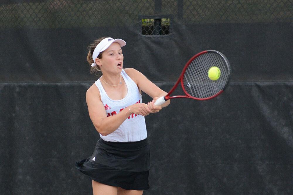 Junior Gina Dittman backhands the ball during the match against South Carolina State in Dail Outdoor Tennis Stadium on Friday, May 5, 2023. Dittman won her singles match 2-0. The Wolfpack defeated the Bulldogs 4-0.&#160;