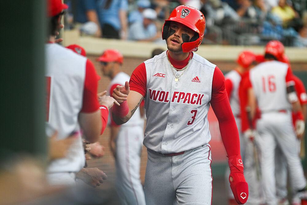 Sophomore infielder Will Marcy celebrates a scored run with his teammates during the game against UNC-Chapel Hill&#160;at Bryson Field at Boshamer Stadium on Thursday, May 11, 2023. Marcy had two hits and one scored run throughout the game. NC State lost 9-8.