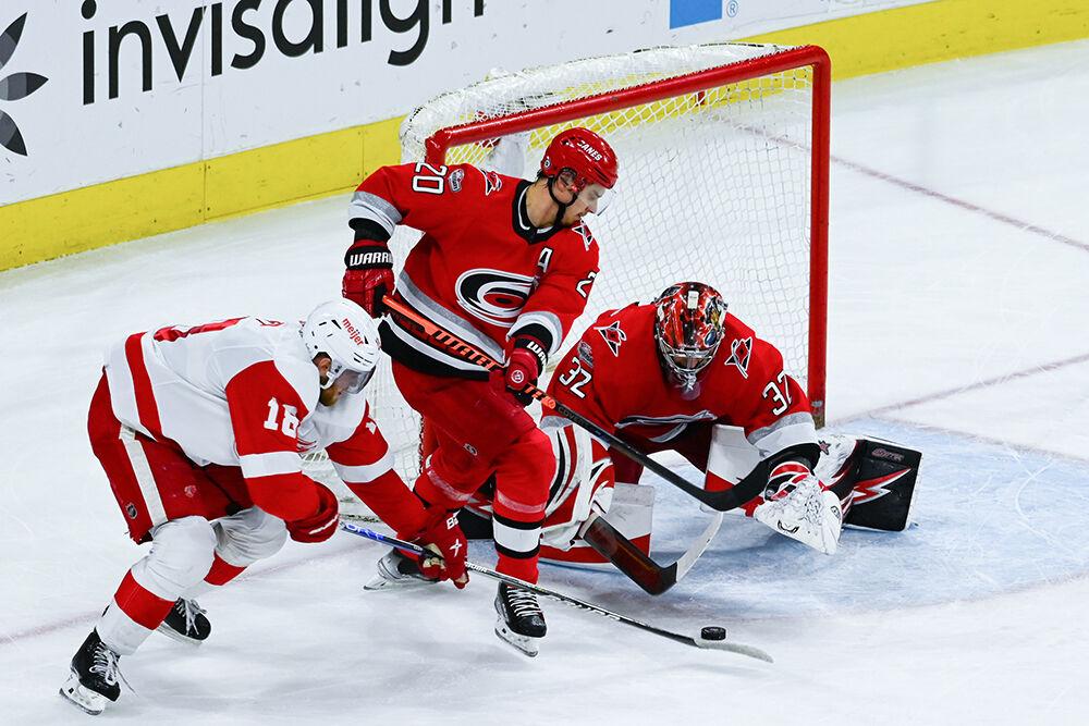Carolina Hurricanes center Sebastian Aho and goalie Frederik Andersen defends Detroit Red Wings opponent in PNC Arena on Tuesday, April 11, 2023. The Hurricanes won 4-1.