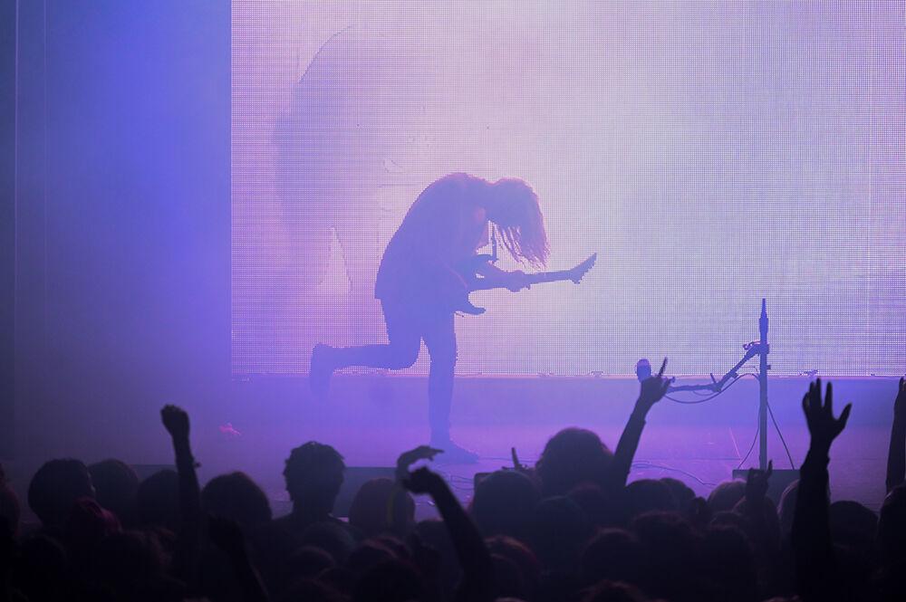 Laura Les, one half of 100 Gecs, plays electric guitar at The Ritz in Raleigh on Tuesday, May 2, 2023. The concert, opened by Machine Girl had some of 100 Gecs' biggest hits performed such as "money machine" and "hand crushed by a mallet."