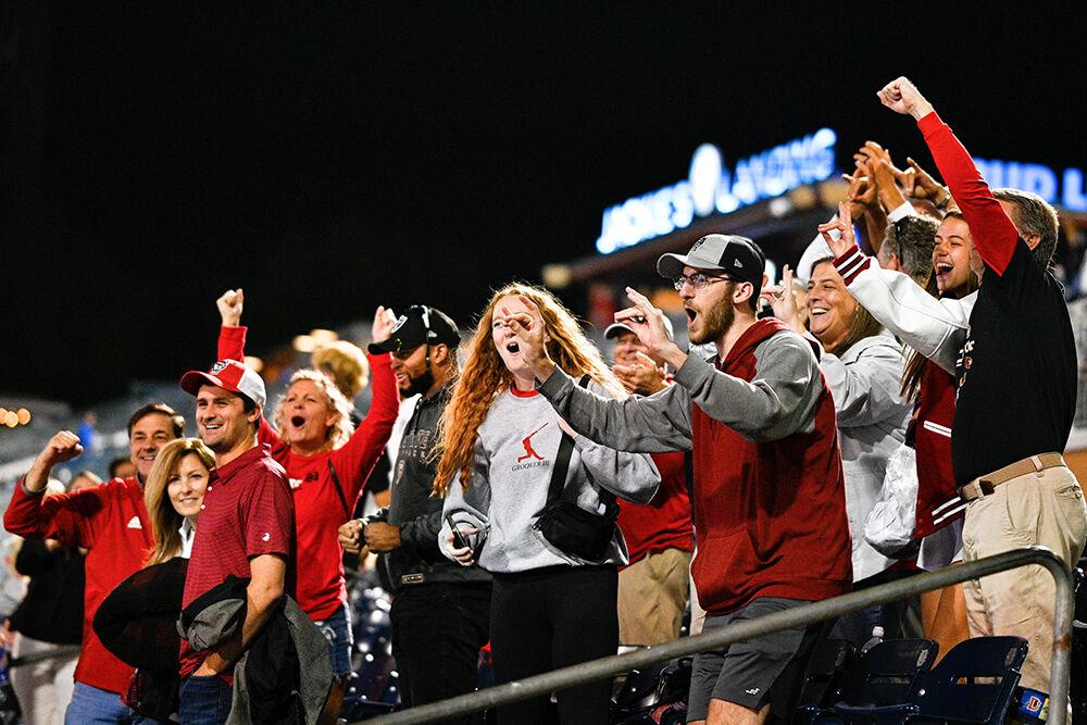 NC State fans celebrate after a close ACC Tournament game against Duke at Durham Bulls Athletic Park on Tuesday, May 23, 2023. NC State Beat Duke 8-7.