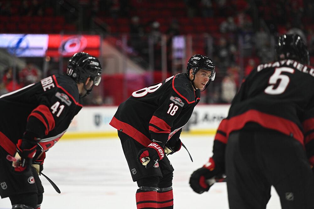 Carolina defenseman Shayne Gostisbehere (left), Jack Drury (center) and Jalen Chatfield hunch over after the Hurricanes' home game against the Tampa Bay Lightning in PNC Arena on Tuesday, March 28, 2023. The Lightning beat the Canes 4-0.
