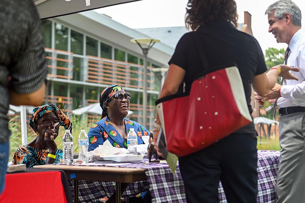 Maram Bojamj and Haddy Njie speak to event goers about their project titled Gambian Girl Power during the Juneteenth Celebrations at Stafford Commons on Monday, June 19, 2023. According to their poster, Gambian Girl Power serves to "empower young girls in The Gambia and keep them in school." Juneteenth&#160;is a holiday that celebrates the emancipation of enslaved African Americans in the United States annually on June 19.