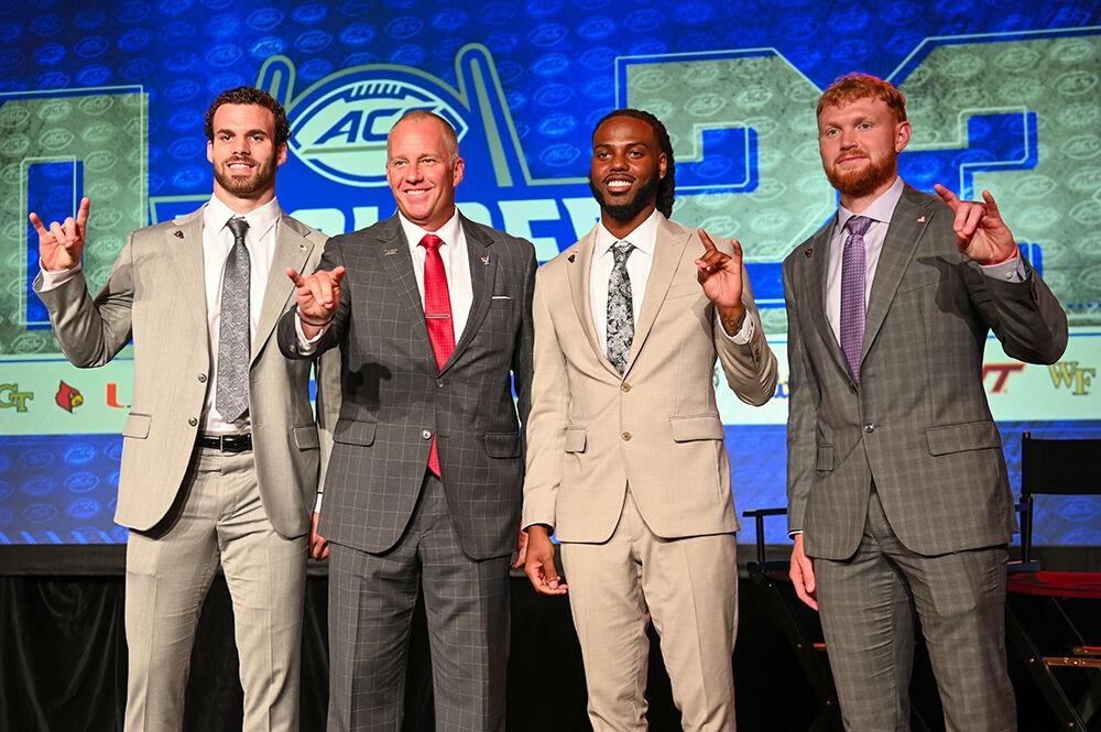(From left) Graduate linebacker Payton Wilson, head coach Dave Doeren, junior cornerback Aydan White and graduate quarterback Brennan Armstrong pose for a photo at the 2023 ACC Kickoff at the Westin in Charlotte, NC, on Thursday, July 27, 2023. In interviews, Doeren reflected on struggles the team experienced this past season and their expectations for the future.