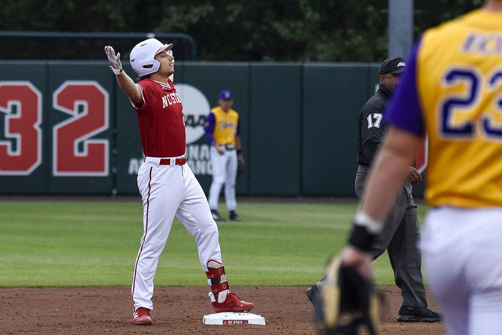 Junior outfielder Carter Trice celebrates after reaching second base during the game against East Carolina University at Doak Field at Dail Park on Tuesday, April 25, 2023. NC State beat East Carolina 5-4.