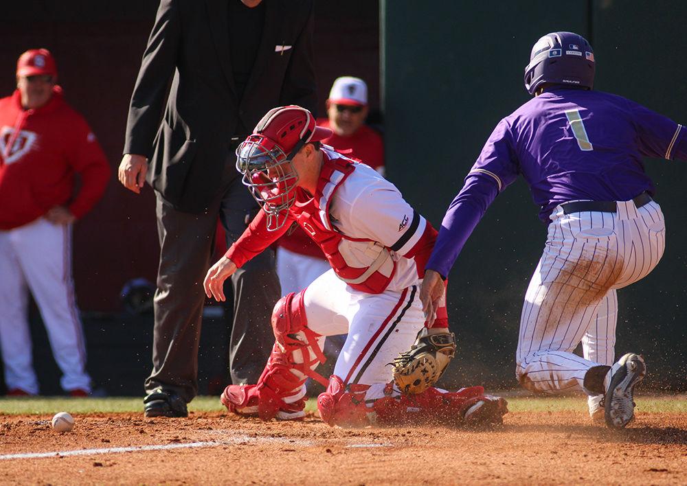 Patrick Bailey, a third year catcher, prepares to tag the runner out at home at the baseball game against James Madison on Saturday, Feb. 15 at Doak Field. Bailey broke the NC State Freshman home run record with 13 in 2018.