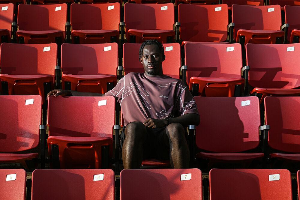 Graduate defender Kendall Edwards poses for a portrait in the stands at Dail Soccer Field on Monday, Aug. 14, 2023. Edwards is co-captain of the men's soccer team and has a creative video internship with Pack Athletics. While reflecting on how he balances being a student athlete and having an internship he said "I enjoy the duality of what I do, because there's been times where you just get really sad about a game or get really caught up in the moment of how a week's going, how a season&#8217;s going. But I think having an outlet has allowed me to look at the bigger picture and enjoy the whole experience as opposed to just [basing] everything off of what happens on the field.&#8221;