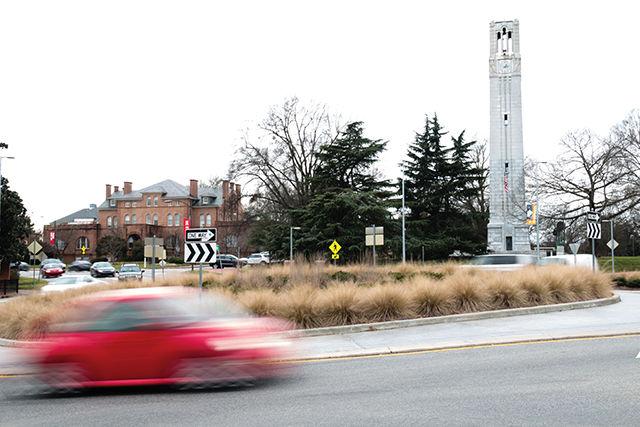 A red car drives through the traffic circle at the intersection of Pullen Rd and Hillsborough St on January 20, 2016.&#160;