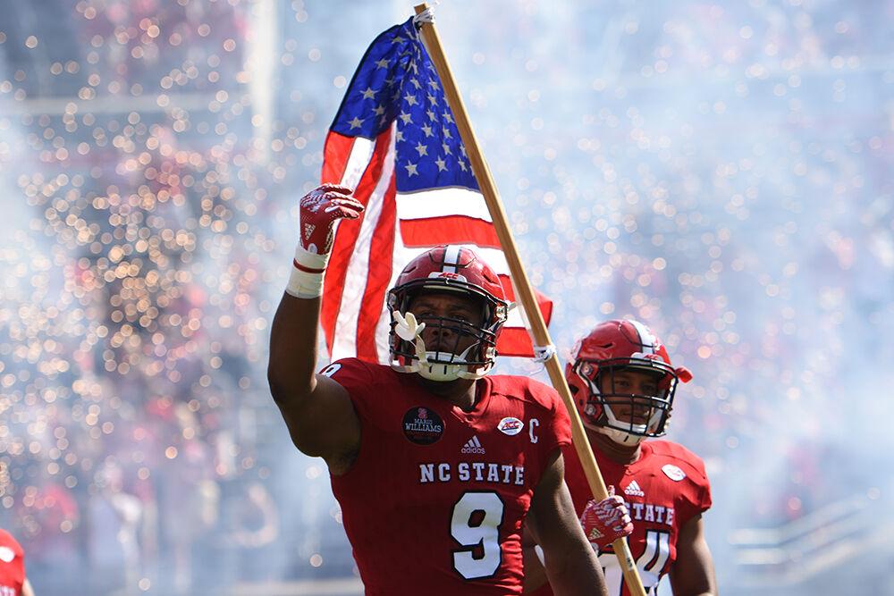 Junior defensive end Bradley Chubb gets the crowd pumped up for the game on Saturday, Oct. 1, 2016 in Carter-Finley Stadium. The Wolfpack defeated Wake Forest 33-16.