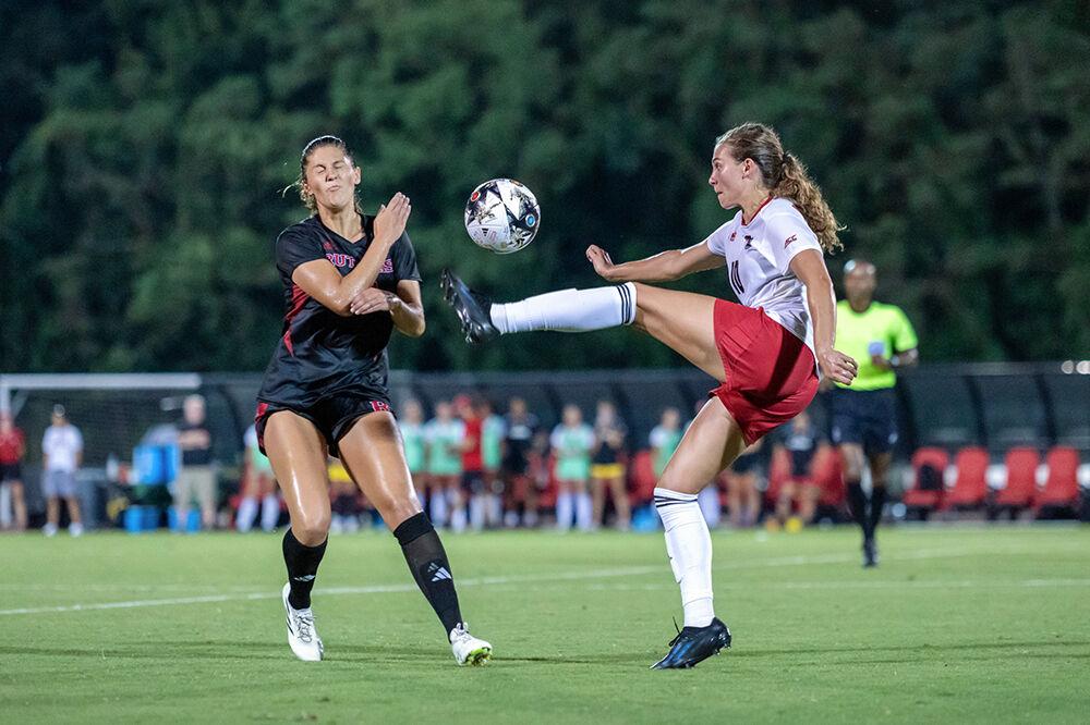 Junior midfielder Annika Wohner tries to settle the ball but ends up with a high kick against the Rutgers Scarlet Knights in Dail Soccer Field on Thursday, Aug. 24, 2023. Wohner scored a goal in the 87th minute to secure a tie with Rutgers. NC State tied with Rutgers 1-1.