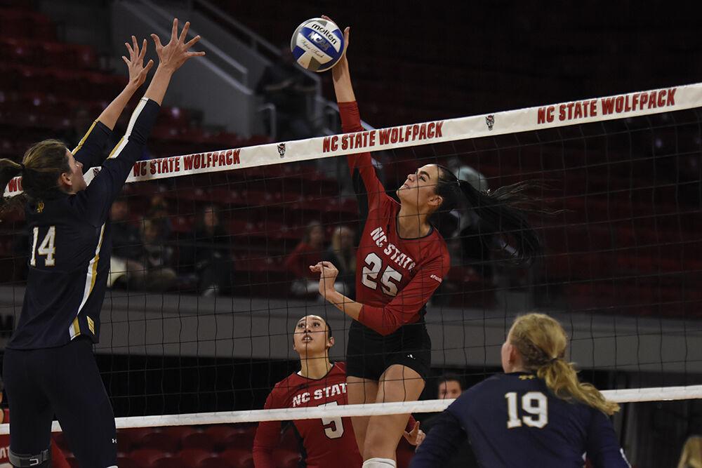 Junior middle blocker Riley Shaak spikes the ball during the game against Notre Dame on Saturday, Nov. 19, 2022 in Reynolds Coliseum. Shaak made six kills, two digs and two blocks for the Wolfpack. NC State beat Notre Dame 3-0.