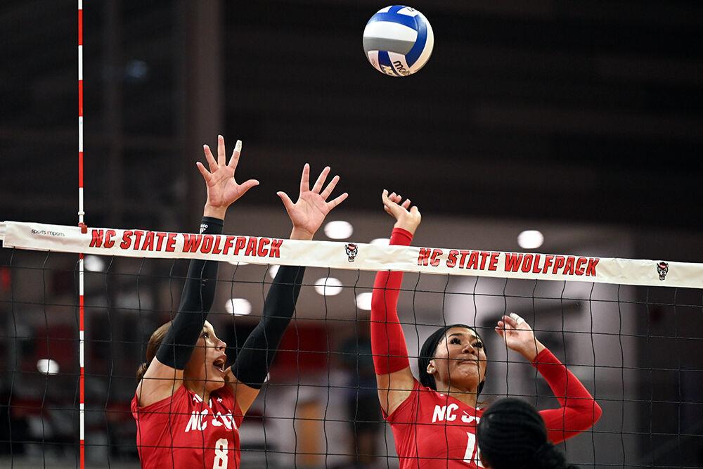 Senior setter Naomi Cabello and junior middle blocker Jada Allen jump to block the ball during the game against Howard University&#160;in Reynolds Coliseum on Thursday, Aug. 31, 2023. NC State beat Howard University 3-1.