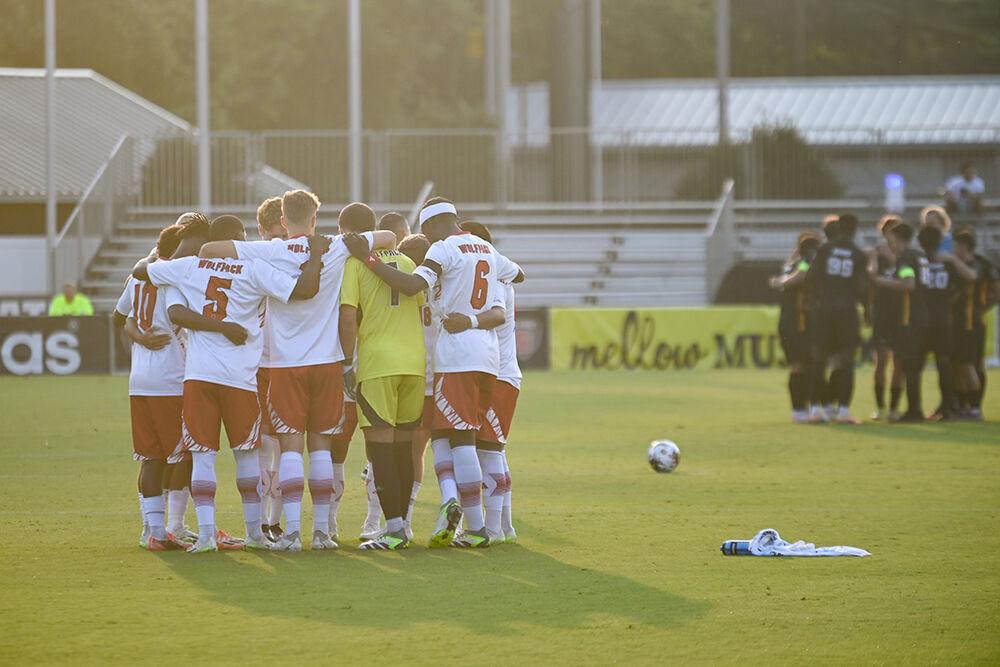 Members of the men's soccer team huddle up during the exhibition match against the VCU Rams at Dail Soccer Field on Saturday, Aug. 19, 2023. The Wolfpack beat the Rams 3-1.