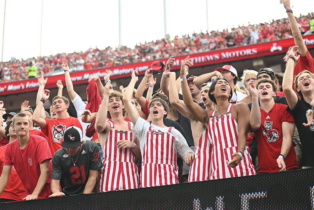 NC State students cheer on the Wolfpack during their home opener against the Notre Dame Fighting Irish in Carter-Finely Stadium on Saturday, Sept. 9, 2023. After a severe rain delay, the Irish defeated the Wolfpack 45-24.