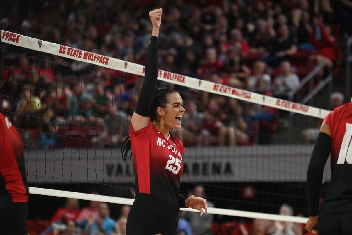 Senior middle blocker Riley Shaak celebrates a point during the match against Rutgers in Reynolds Coliseum on Friday, Sept. 1, 2023. Shaak made five blocks for the Wolfpack. NC State won 3-2.