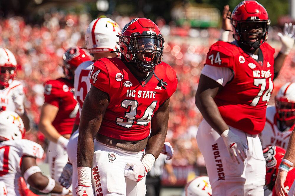Redshirt junior running back Delbert Mimms celebrates after scoring a touchdown during the game against VMI in Carter-Finley Stadium on Sept. 16, 2023. Mimms scored two touchdowns and had 35 rushing yards during the game. NC State beat VMI 45-7.