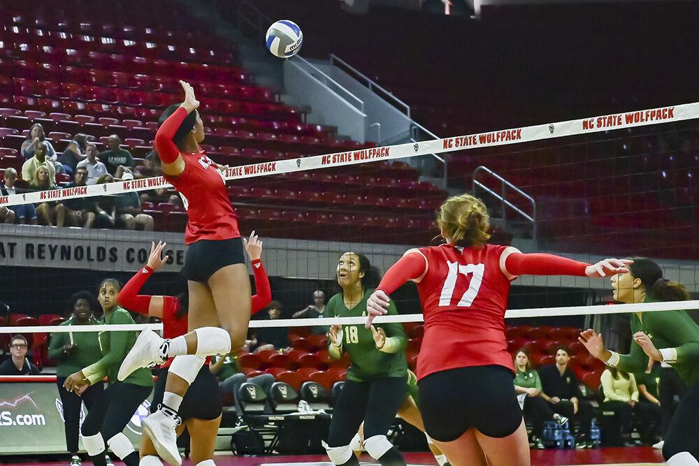 In this file photo taken Sept. 12, 2023,&#160;middle blocker Jada Allen spikes the ball in the match against UNC-Charlotte at Reynolds Coliseum. This week NC State played Georgia Tech on Sept. 24, 2023, in Atlanta Georgia. Georgia Tech beat NC State 3-1.
