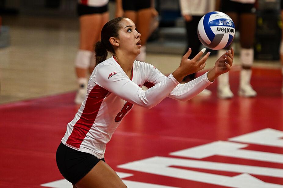 Senior setter Naomi Cabello serves the ball during the match against George Washington University in Reynolds Coliseum on Wednesday, Sept. 13, 2023. NC State beat George Washington with a score of 3-0.