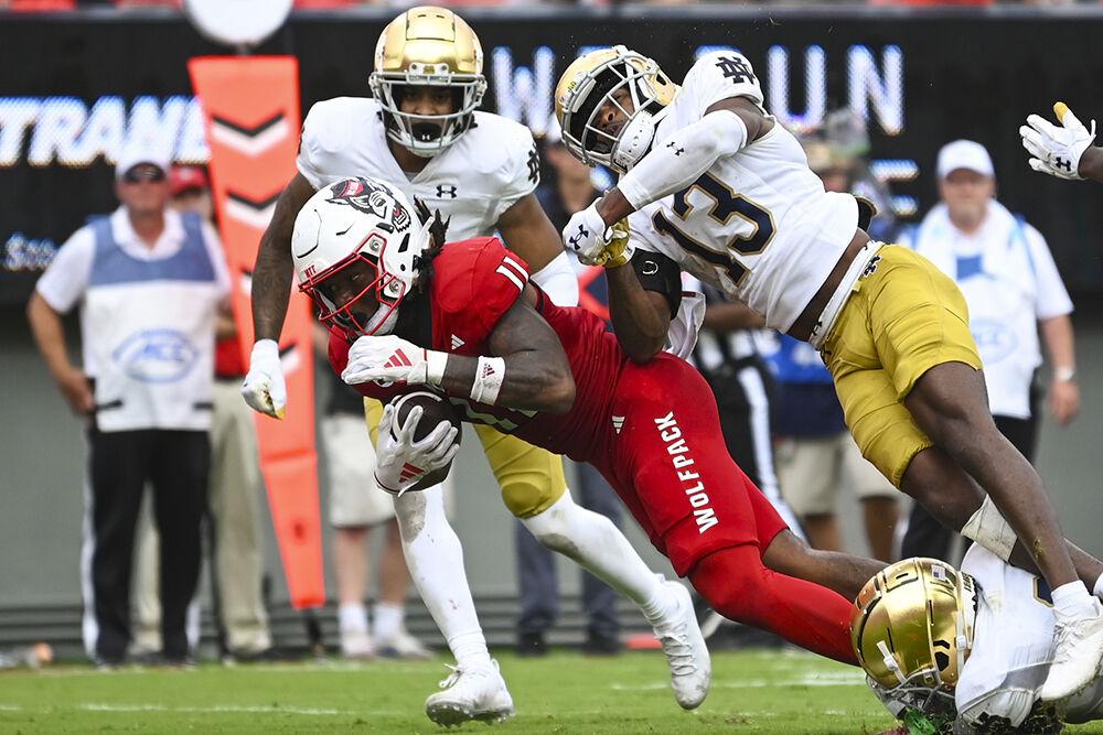 Freshman tight end Juice Vereen dives while clutching the ball at the game against Notre Dame at Carter-Finley Stadium on Saturday, Sept. 9, 2023. Vereen had 65 receiving yards during the game. The Wolfpack fell to the Fighting Irish 45-24.