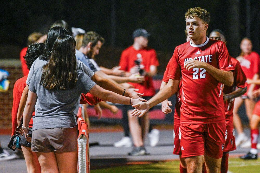 Sophomore midfielder Drew Lovelace high-fives fans after a win against the University of North Florida at Dail Soccer Field on Wednesday, Sept. 20, 2023. NC State beat the University of North Florida 1-0. &#160; &#160;