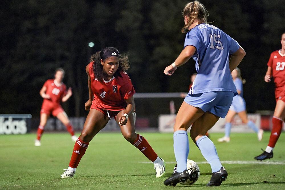Senior forward Leyah Hall-Robinson tracks the ball at her opponent's feet during the match against UNC-Chapel Hill on Saturday, Sept. 30, 2023. For the second time this season, NC State has set a new attendance record for women's soccer with 3,972 people. NC State lost 4-0 to Chapel Hill.