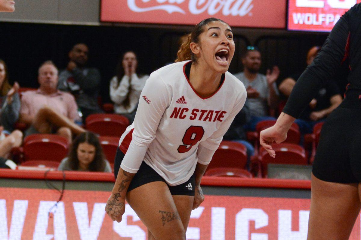 Senior libero Skye Stokes yells in celebration of a point during the third set in the match against Notre Dame in Reynolds Coliseum on Friday, Sept. 29, 2023. Stokes made seven digs. The Wolfpack defeated the Fighting Irish 3-0.