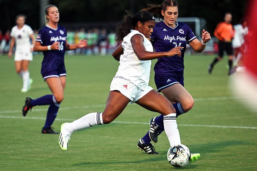 Senior forward Leyah Hall-Robinson attempts to keep the ball in possession during the match against High Point at Dail Soccer Field on Thursday, Sept. 14, 2023. Hall-Robinson made three shots for the Pack. NC State and High Point tied 2-2.