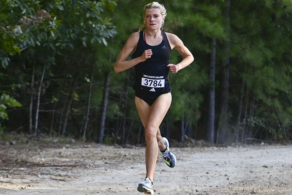 Freshman runner Leah Stephens races up the hill at the Adidas XC Challenge at WakeMed Soccer Park on Sept. 15, 2023. Stephens individually finished first in the 5k event with a time of 16:54.8.