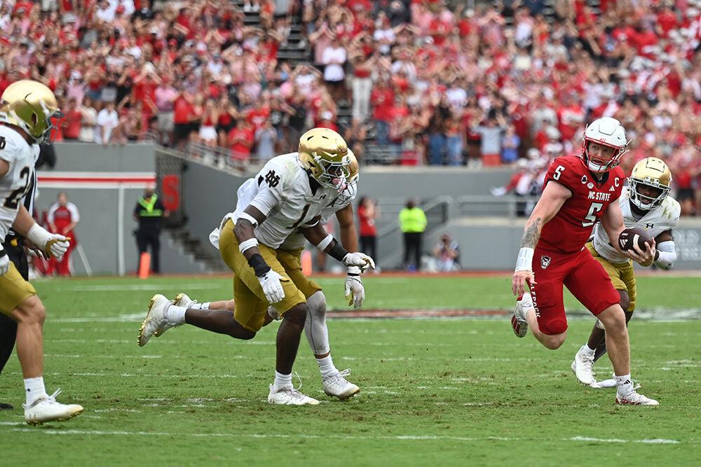 Graduate quarterback Brennan Armstrong escapes the pocket during the Wolfpack's home opener against the Notre Dame Fighting Irish in Carter-Finely Stadium on Saturday, Sept. 9, 2023. Armstrong threw for 260 yards and rushed for a net 26 yards and threw two touchdowns and three interceptions. The Irish defeated the Wolfpack 45-24.