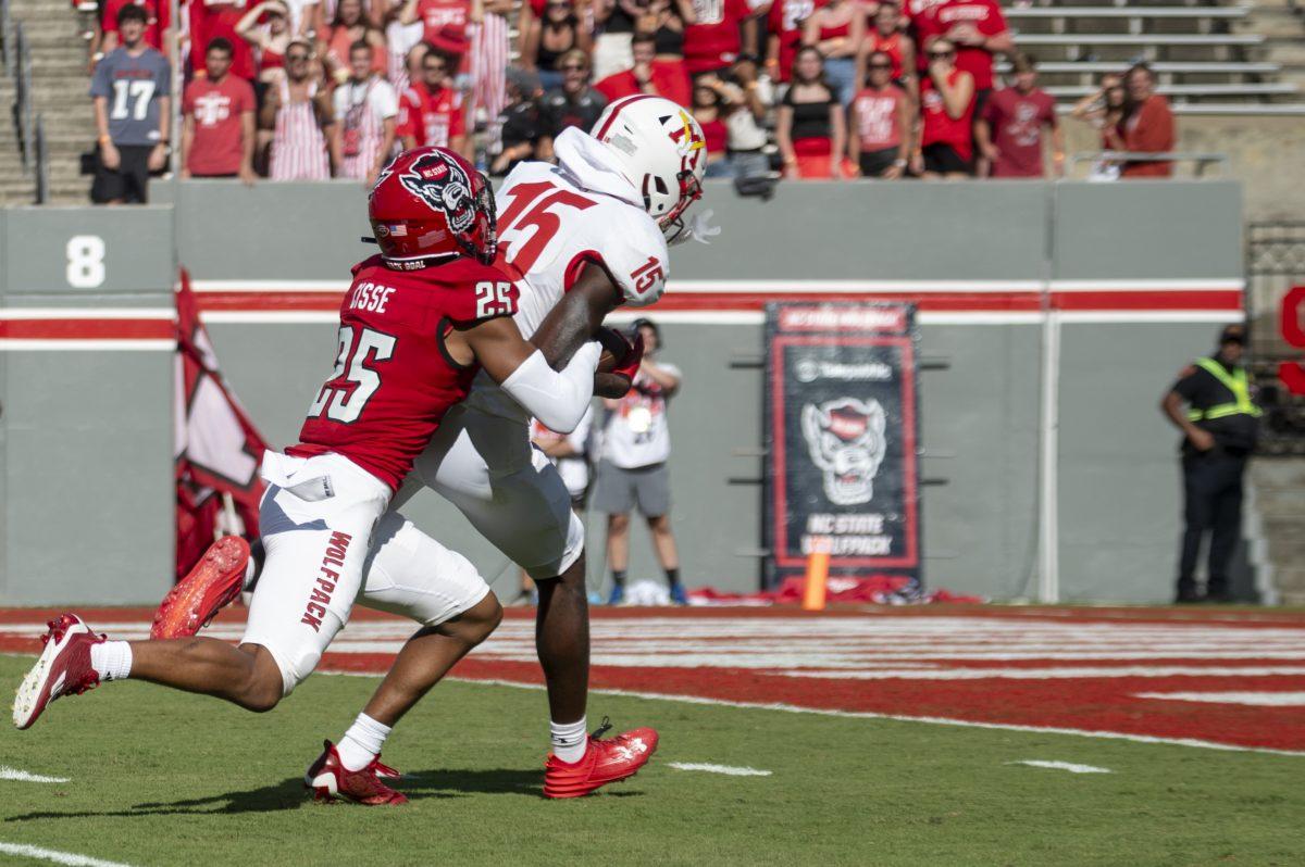 Freshman cornerback Brandon Cisse tries to stop his opponent from scoring during the football game against Virginia Military Institute in Carter-Finely Stadium on Saturday, Sept. 16, 2023. The Wolfpack beat the Keydets 45-7.