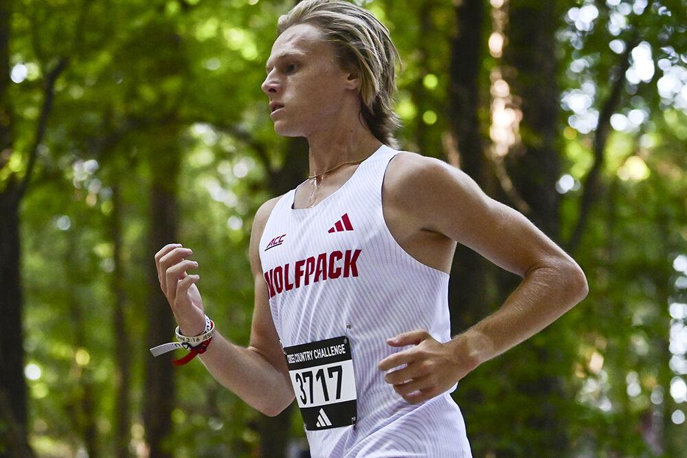 Sophomore runner Ryan Motondo races downhill at the Adidas XC Challenge at WakeMed Soccer Park on Sept. 15, 2023. Motondo ran a time of 18:33.2 in the 6k event, earning an individual placement of 13th. The NC State men's team placed first in the 6k event with a total of 15 points.